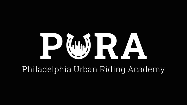 philadelphia urban riding academy logo featuring a horse shoe and philadelphia's city skyline.