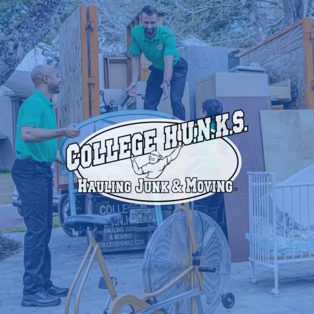 College Hunks logo over blue overlay photo of movers moving a table into a trailer.