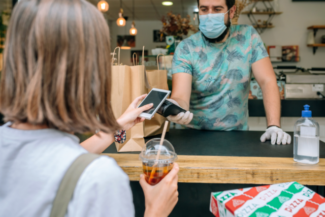 Customer using app to make a purchase in store.