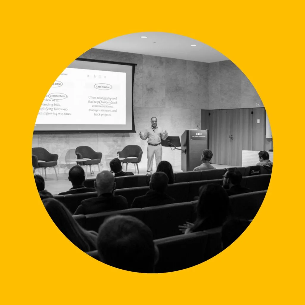 Photo of speaker at the 1682 conference with audience