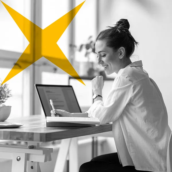Woman sitting at computer.